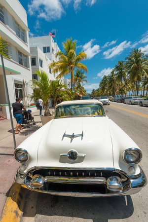 MIAMI,USA - MAY 21,2014   Vintage car parked at Ocean Drive in Miami Beach, Florida  Art Deco architecture in South Beach is one of the main tourist attractions in Miamiのeditorial素材