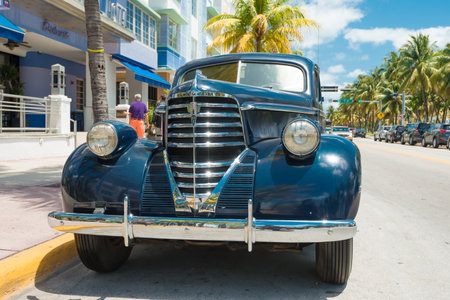 MIAMI,USA - MAY 21,2014   Vintage car parked at Ocean Drive in Miami Beach, Florida  Art Deco architecture in South Beach is one of the main tourist attractions in Miamiのeditorial素材