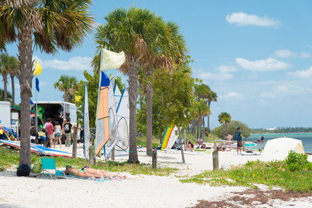 People enjoying the beach on a sunny day in Miamiのeditorial素材