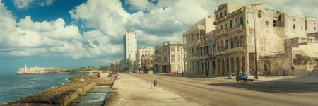 Street scene in Old Havana with old decaying buildings at Malecon and the El Morro castleのeditorial素材