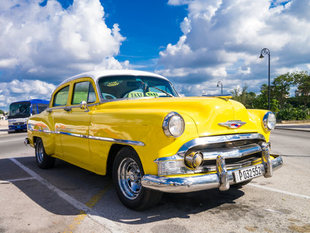 Colorful yellow vintage car in Havanaのeditorial素材