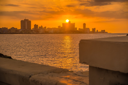 Beautiful colorful sunset in Havana with a view of the Malecon seawall and the city skylineの写真素材