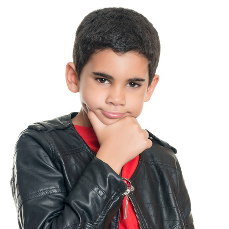 Portrait of a cute hispanic boy wearing a leather jacket isolated on whiteの写真素材