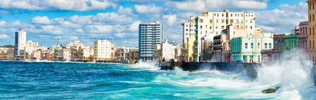 Panoramic view of the Havana skyline waves crashing into the Malecon seawallの写真素材