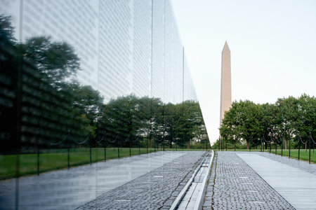 The Vietnam Veterans Memorial in Washington D.C. with the Washington Monument on the backgroundのeditorial素材