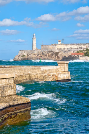 The fortress and lighthouse of El Morro with a stormy sea, a symbol of the city of Havana in Cubaのeditorial素材