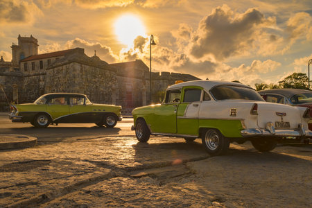 Classic cars in Old Havana illuminated at sunsetのeditorial素材