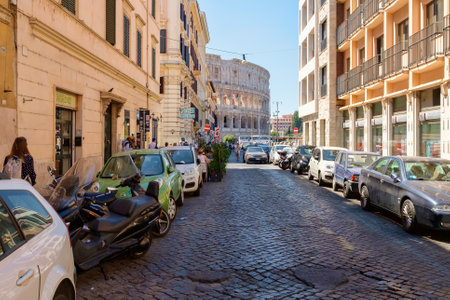 Street scene in Rome with the ruins of the Colosseum on the backgroundのeditorial素材