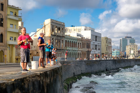 Fishermen at the famous Malecon seawall, a symbol of the city of Havanaのeditorial素材