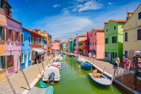 Brightly painted houses and canals on the island of Burano near the city of Veniceのeditorial素材