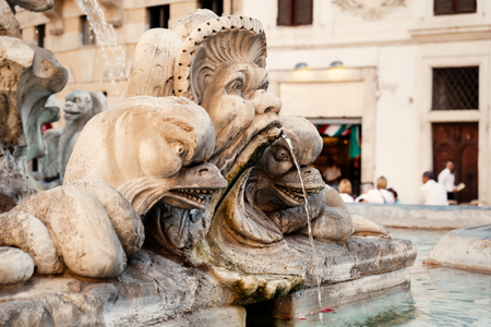 Old fountain on the square next to the Pantheon in Romeの写真素材