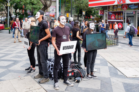 Anonymous activists protesting againt cruelty to animals in the food industryのeditorial素材