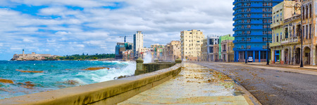 Panoramic view of the Havana skyline and the iconic Malecon seawall with a stormy oceanの写真素材
