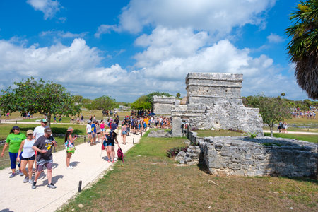 TULUM,MEXICO - APRIL 18,2019 : Visitors at the ancient mayan ruins of Tulum in Mexicoのeditorial素材