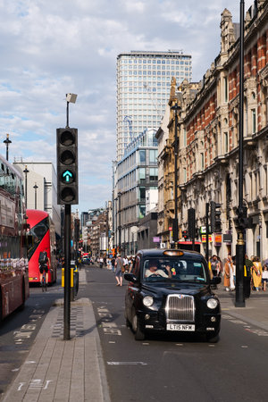 Typical black cab in Oxford Street, the busiest shopping street in Europeのeditorial素材
