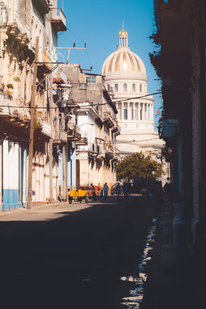 Old colorful buildings in Havana on a street leading to the iconic Capitol, a symbol of the cityのeditorial素材