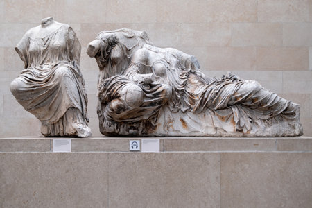 LONDON,UK - JULY 31,2019 : Statues of greek goddesses, part of the Elgin Marbles exhibited at the British Museum and originally located at the temple of the Parthenon in Athensのeditorial素材