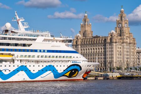 Cruiser ship docked at the Port of Liverpool with a view of the iconic Royal Liver Buildingの写真素材