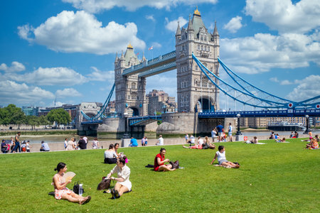 People enjoying summer near Tower Bridge in Londonのeditorial素材