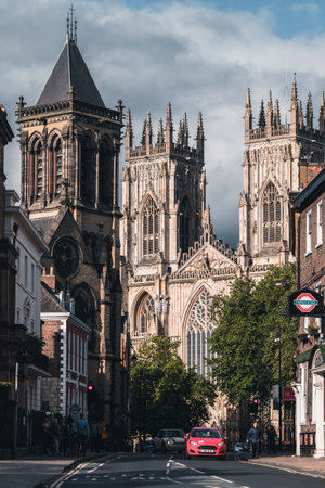 Street scene in York with a view of the York Cathedral and several historic buildingsのeditorial素材