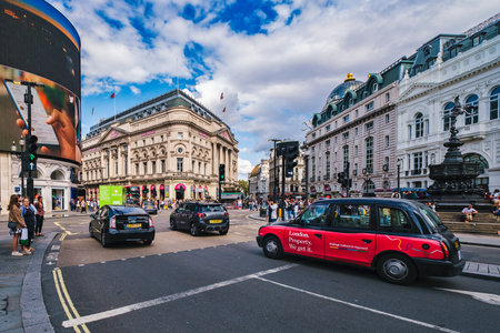 Traffic at Piccadilly Circus in London with a view of several landmarksのeditorial素材