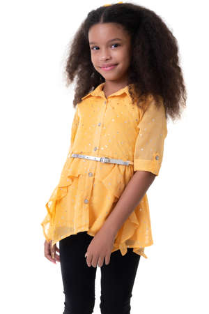 Portrait of a trendy multiracial small girl isolated on a white backgroundの写真素材
