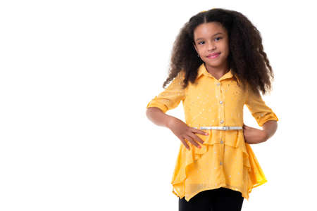 Portrait of a trendy multiracial small girl isolated on a white backgroundの写真素材