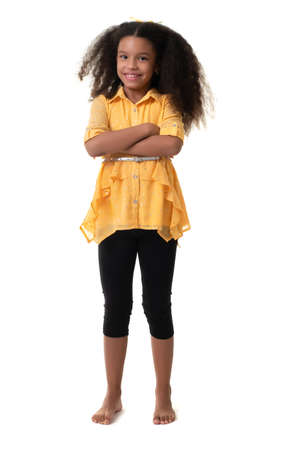 Cute multiracial small girl with a beautiful curly hair - Isolated on a white backgroundの写真素材
