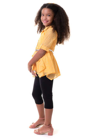 Cute multiracial small girl with a beautiful curly hair - - Isolated on a white backgroundの写真素材