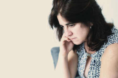 Portrait of a sad hispanic woman - with space for textの写真素材