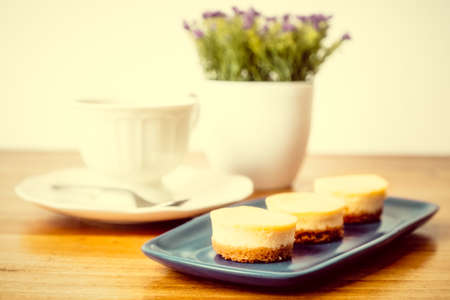 Small round homemade cheesecakes served with tea for a snackの写真素材