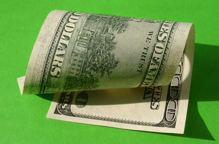 One hundred dollar note - rolledの写真素材