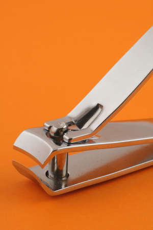 nail clippers on orangeの写真素材