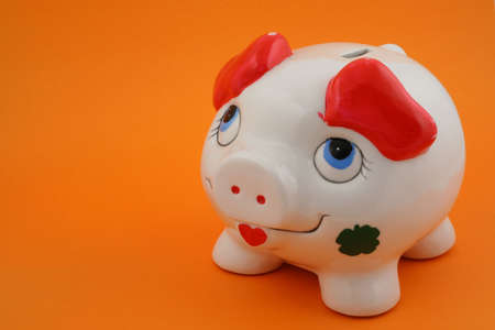 piggy bank on orangeの写真素材