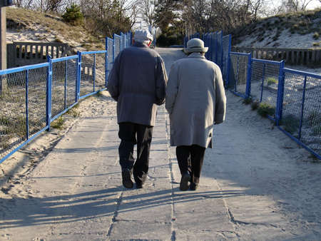 old couple after beach walkの写真素材