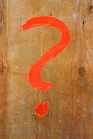 question mark painted on woodの写真素材