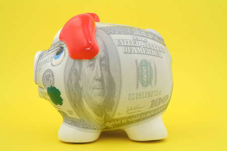 100 bucks piggy bank  - the photo does not infringe any copyrightの写真素材