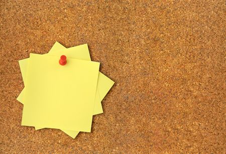 close-up of corkboard and blank adhesive notesの写真素材