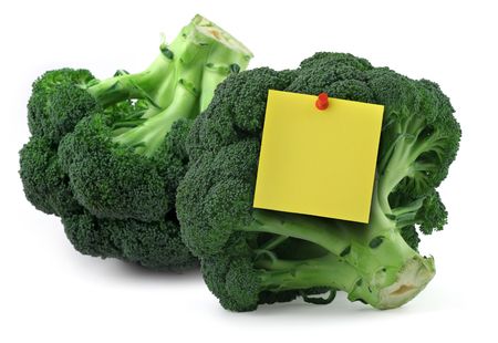 broccoli with blank yellow note on white, gentle natural shadow underneathの写真素材