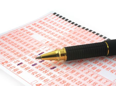 close-up of lottery ticket and ballpoint penの写真素材