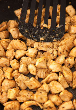 chicken meat fried on frying panの写真素材