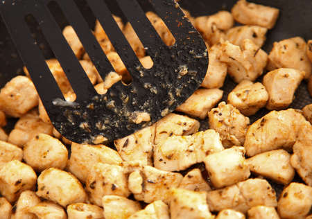 chicken meat fried on frying panの写真素材