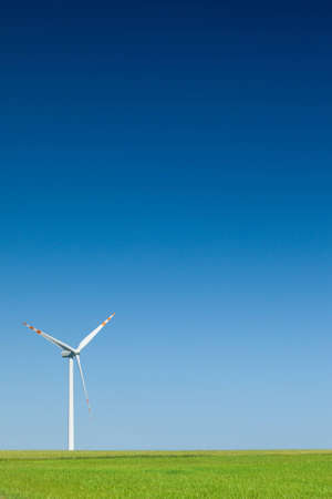 single wind turbine, cloudless sky in backgroundの写真素材