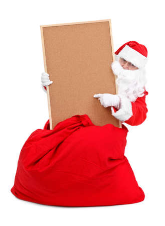 Santa claus and empty bulletin board on white backgroundの写真素材