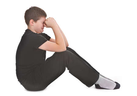 sad kid crying over white backgroundの写真素材