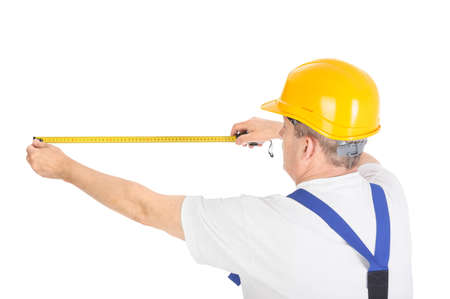 worker with measuring tape over white background