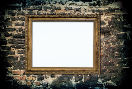 golden wooden frame over ruined brick wall