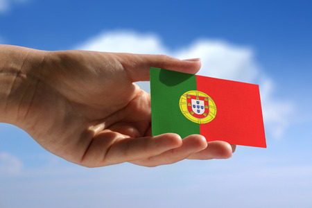 National flag of Portugal over skyの写真素材