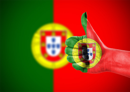 National flag of Portugal on hand.の写真素材
