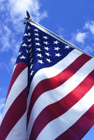 an American flag against a blue sky